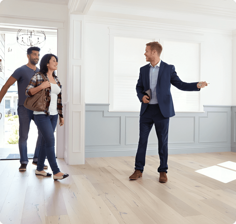 Real estate agent showing couple a new home.