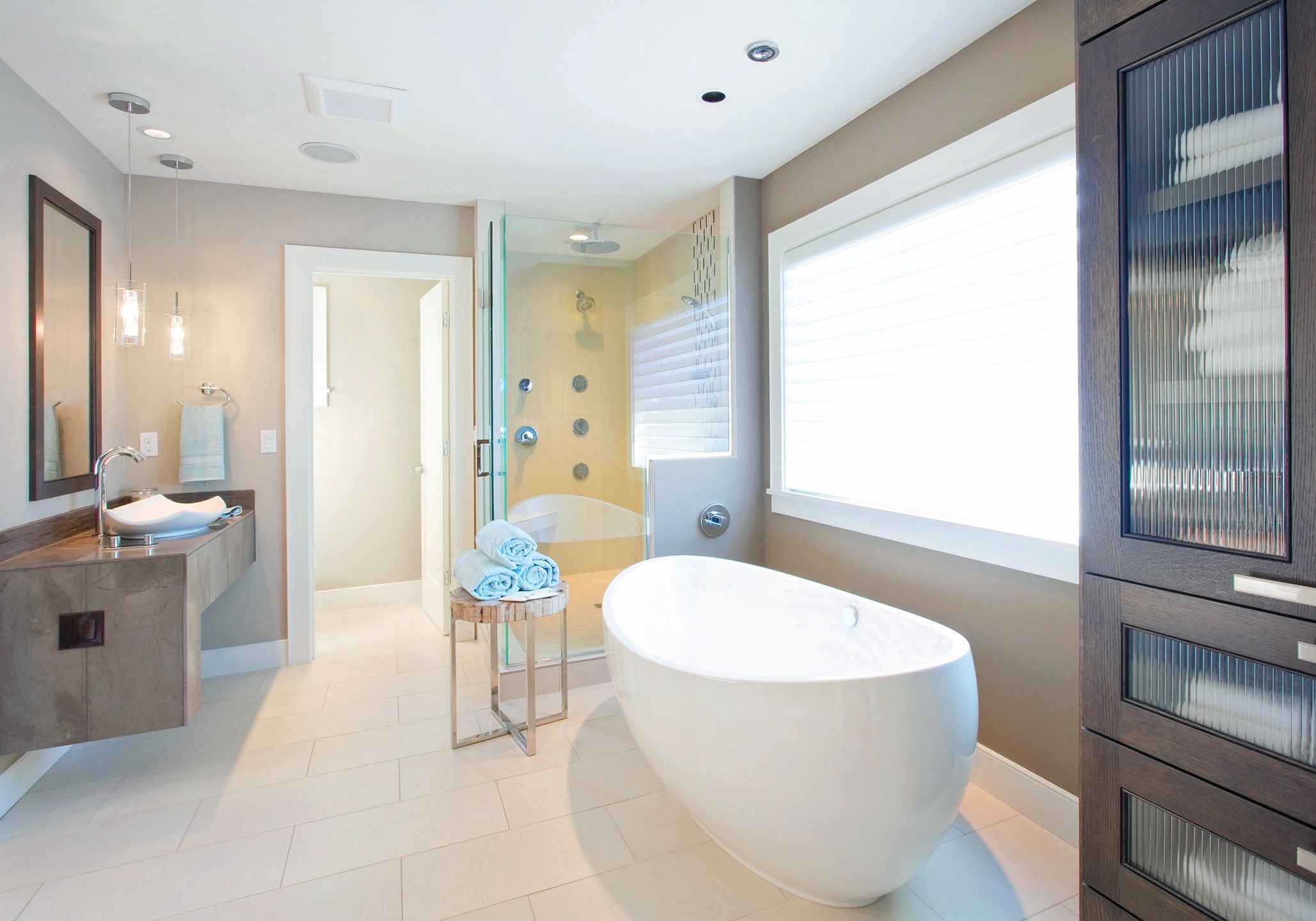 RES 1 A bathroom with a large tub and shower.